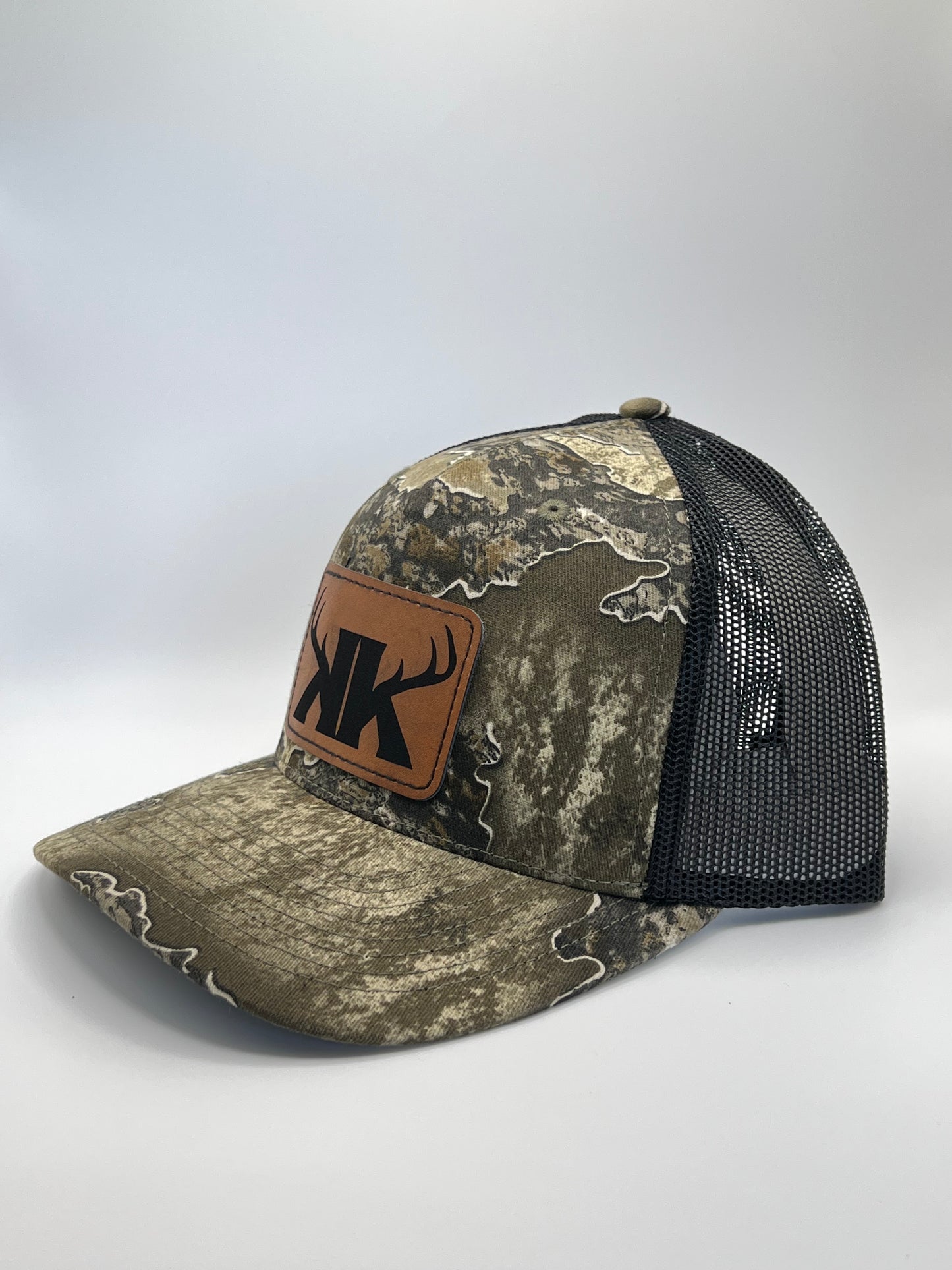Split Rack Real Tree Escape/Black Trucker Hat